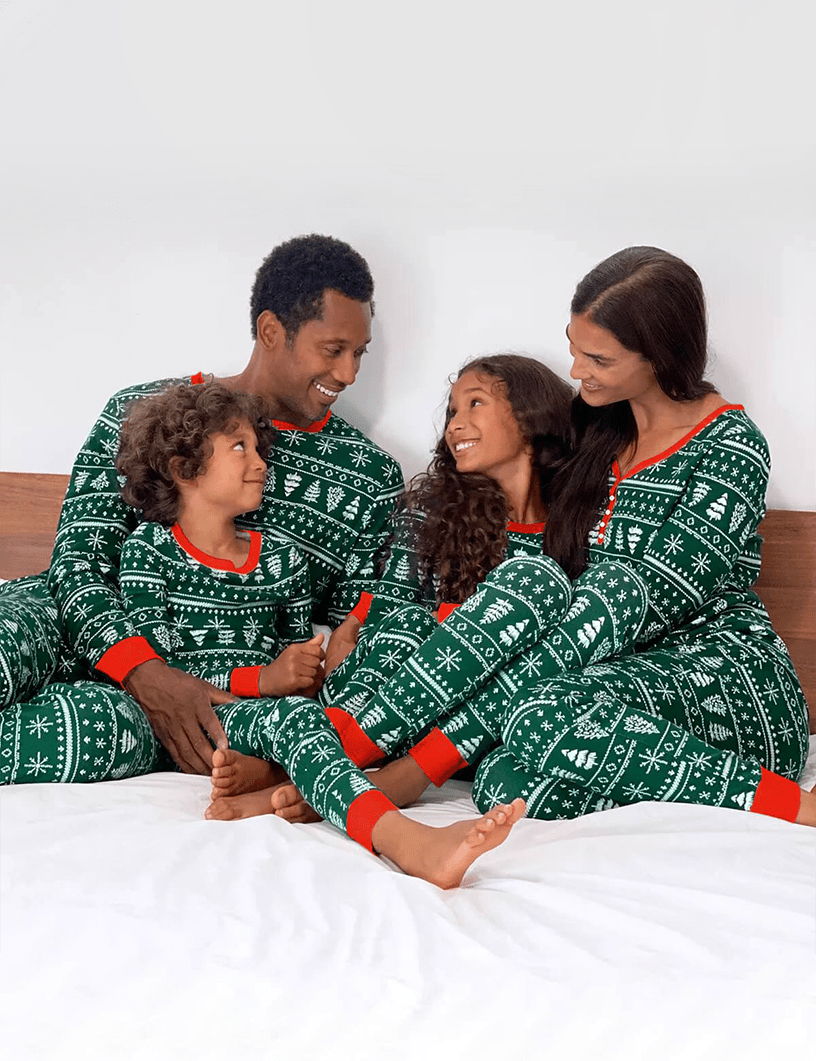 Matching family Christmas pajamas in green with white tree and snowflake print and red cuffs - view 6