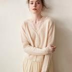 Woman wearing a gray fuzzy knit V-neck cardigan with lace trim and pearly buttons - view 16
