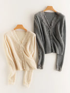 Woman wearing a gray fuzzy knit V-neck cardigan with lace trim and pearly buttons - view 22