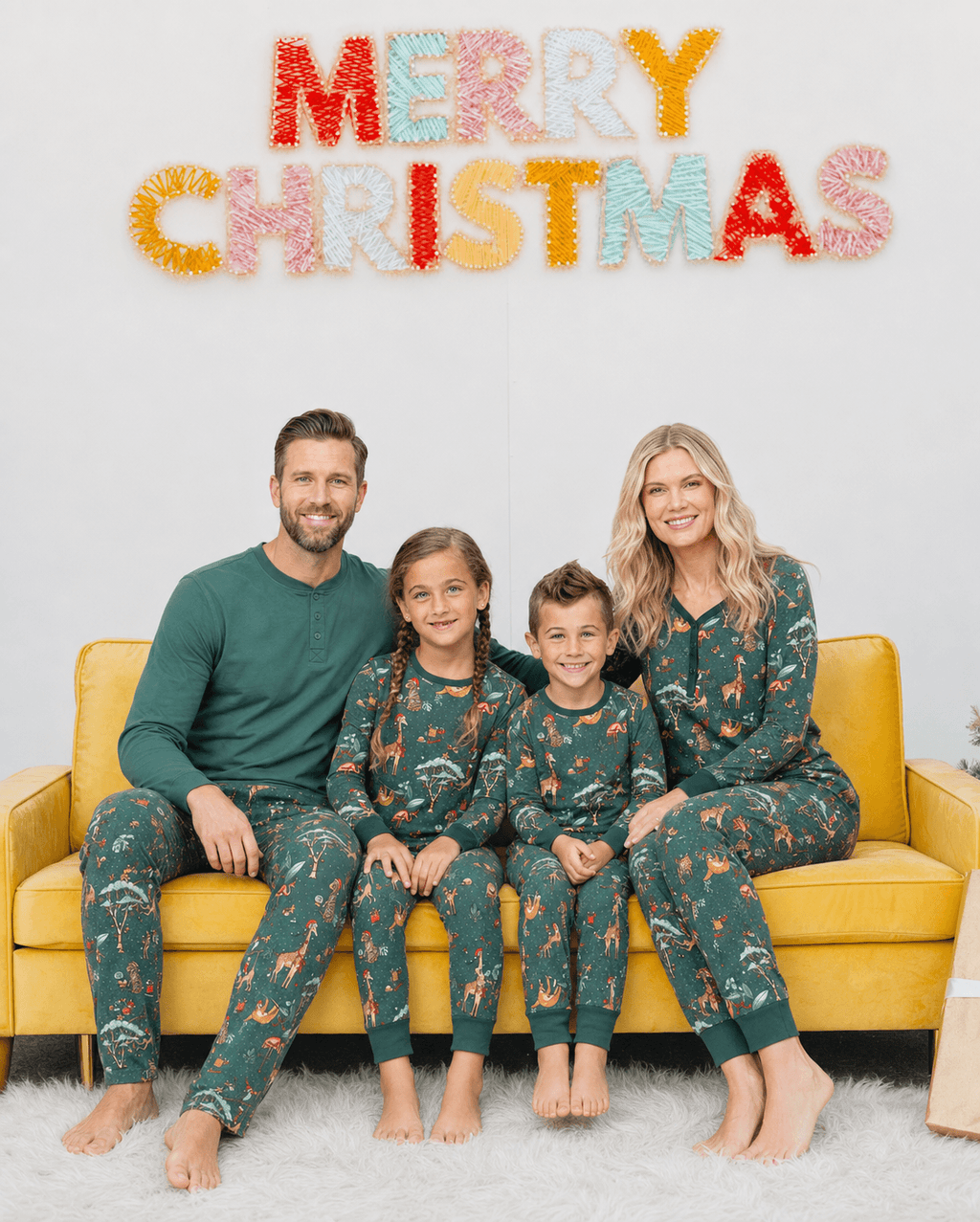 Family wearing matching green safari animal print Christmas pajamas