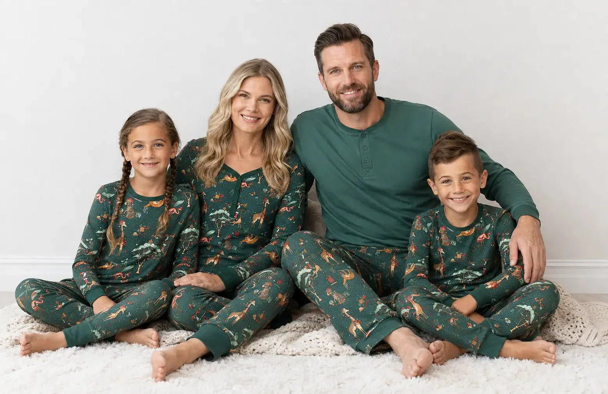 Family wearing matching green safari animal print Christmas pajamas - view 5
