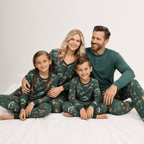 Family wearing matching green safari animal print Christmas pajamas - view 7