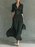 Black pleated A line maxi dress with shirt collar and gold-button waistband