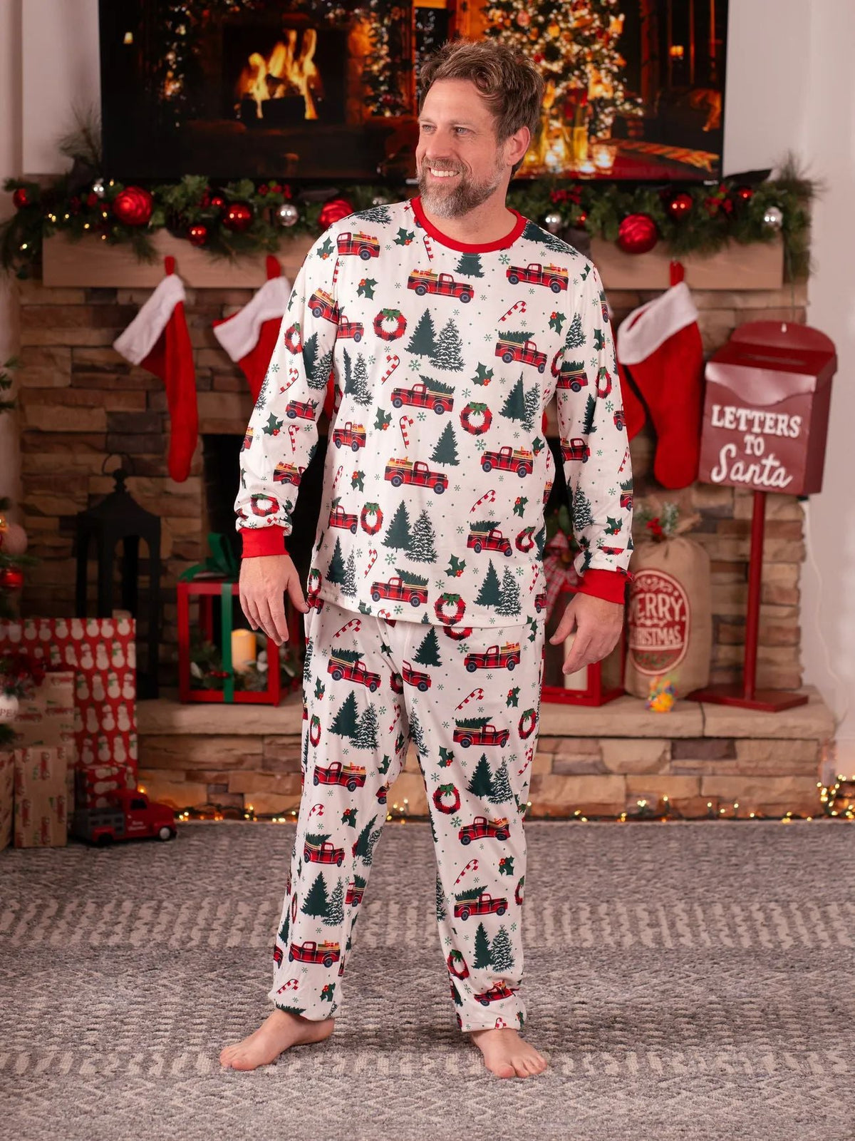 Matching family Christmas pajamas with red truck and tree print and red ribbed trim - view 9