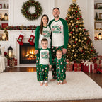Family wearing matching white and green Merry and Bright Christmas pajamas with Santa print pants