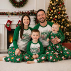 Family wearing matching white and green Merry and Bright Christmas pajamas with Santa print pants - view 2