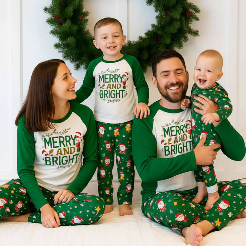 Family wearing matching white and green Merry and Bright Christmas pajamas with Santa print pants - view 3