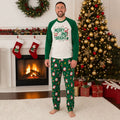 Family wearing matching white and green Merry and Bright Christmas pajamas with Santa print pants - view 4