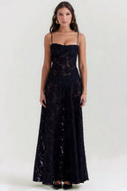 Sheer floral bustier maxi dress with spaghetti straps and flowing floor-length skirt