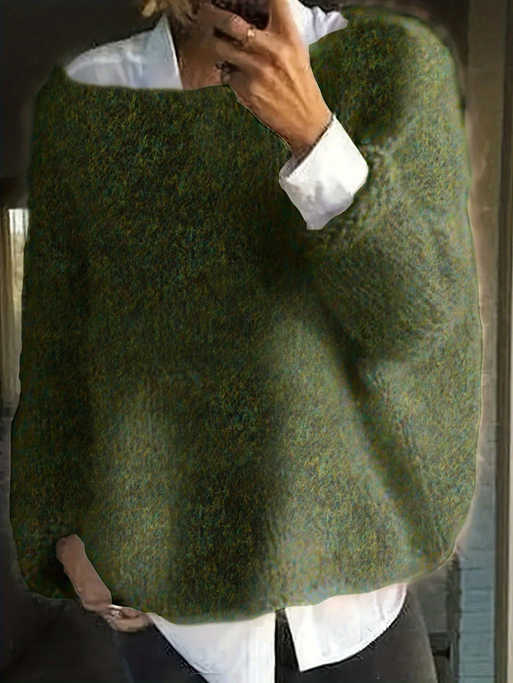 Women's oversized fuzzy knit sweater with wide round neckline layered over a white shirt