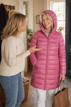 Women's long pink hooded puffer coat with quilted shell and front zip - view 9