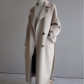 Women's long belted double-breasted trench coat with notch lapels