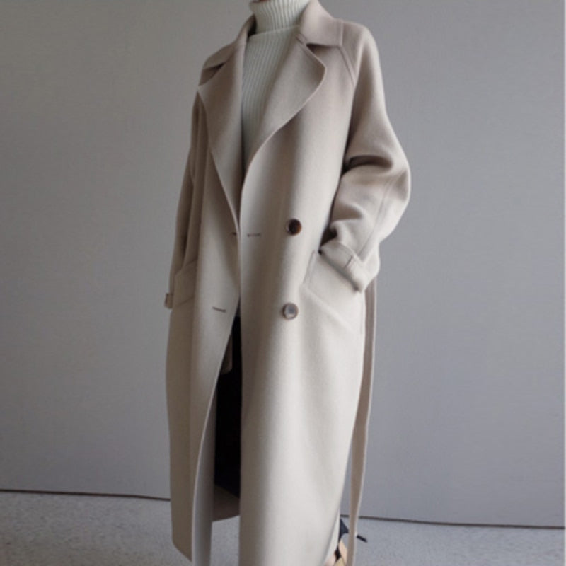 Women's long belted double-breasted trench coat with notch lapels