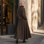 Woman in a brown knit turtleneck and A-line maxi skirt set outdoors - view 6