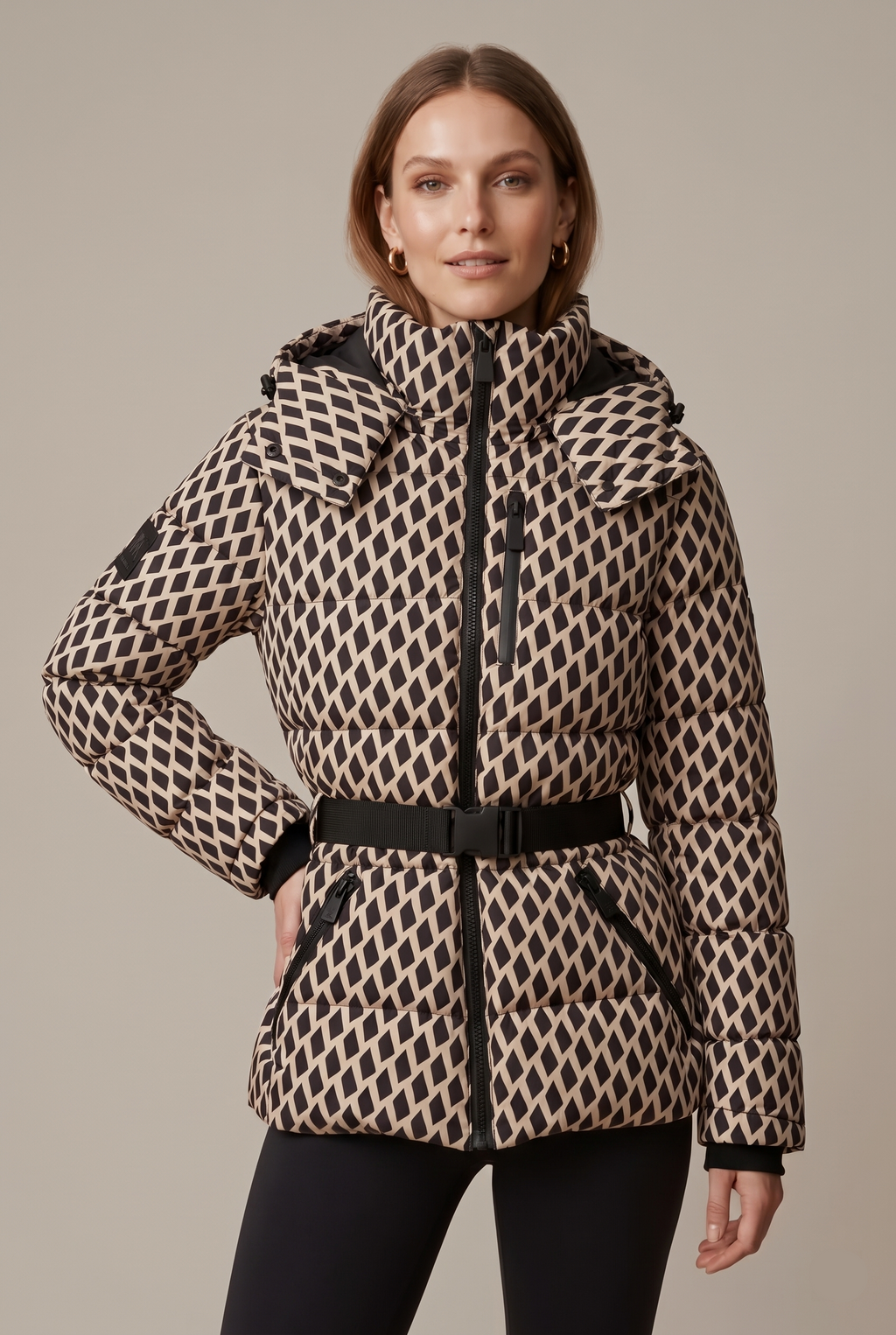 Quilted puffer jacket with buckle belt, hood and zip pockets on model