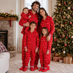 Red hooded footed Christmas onesie with string-light bulb print worn by a matching family