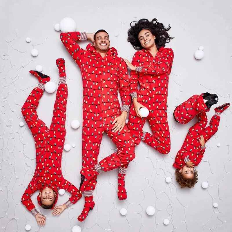 Red hooded footed Christmas onesie with string-light bulb print worn by a matching family - view 3