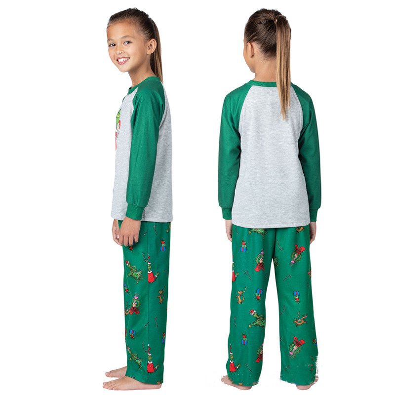Matching family Christmas pajamas with gray raglan top, green sleeves and green character print pants - view 10