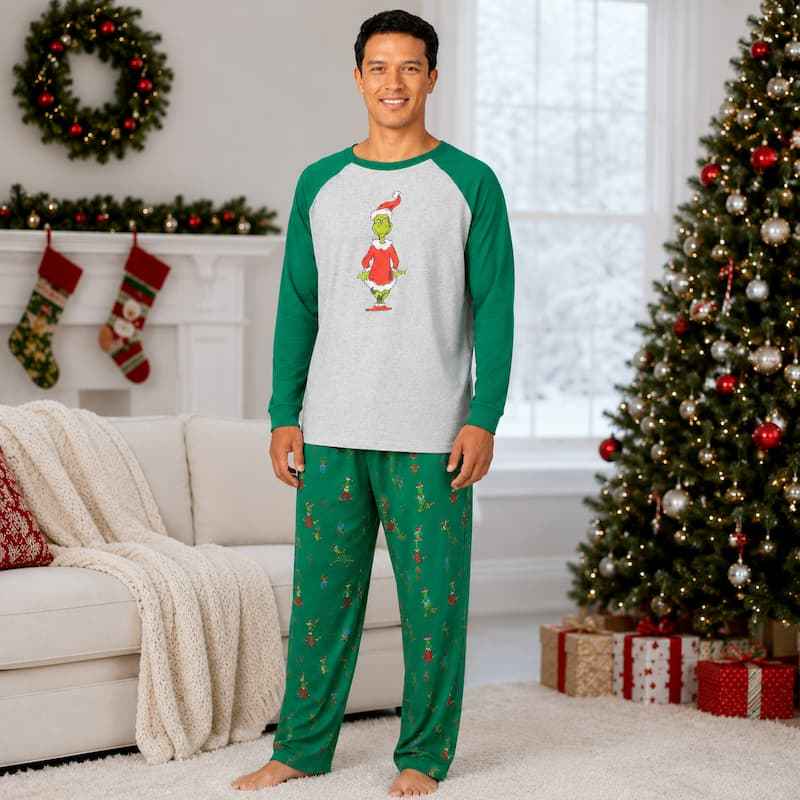 Matching family Christmas pajamas with gray raglan top, green sleeves and green character print pants - view 2