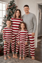 Family wearing matching red and white striped Christmas pajamas with gray trim - view 4