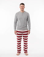 Family wearing matching red and white striped Christmas pajamas with gray trim - view 8