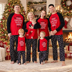 Family matching Christmas pajamas with red raglan slogan tops and black candy cane print pants - view 2