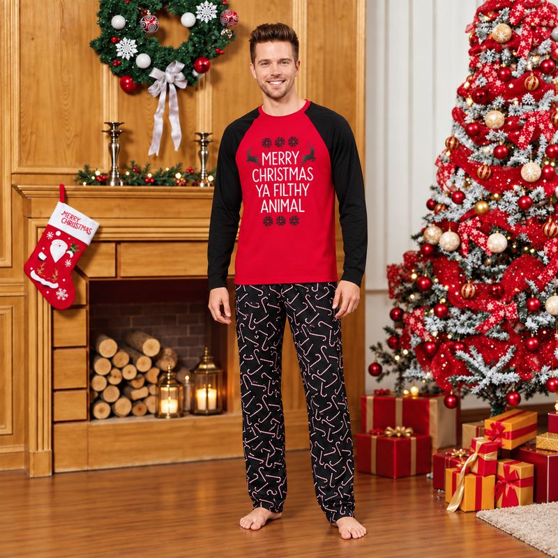 Family matching Christmas pajamas with red raglan slogan tops and black candy cane print pants - view 3