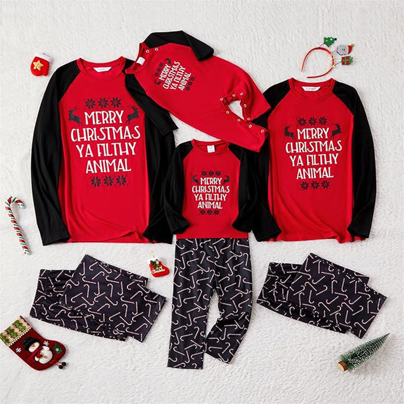 Family matching Christmas pajamas with red raglan slogan tops and black candy cane print pants - view 7