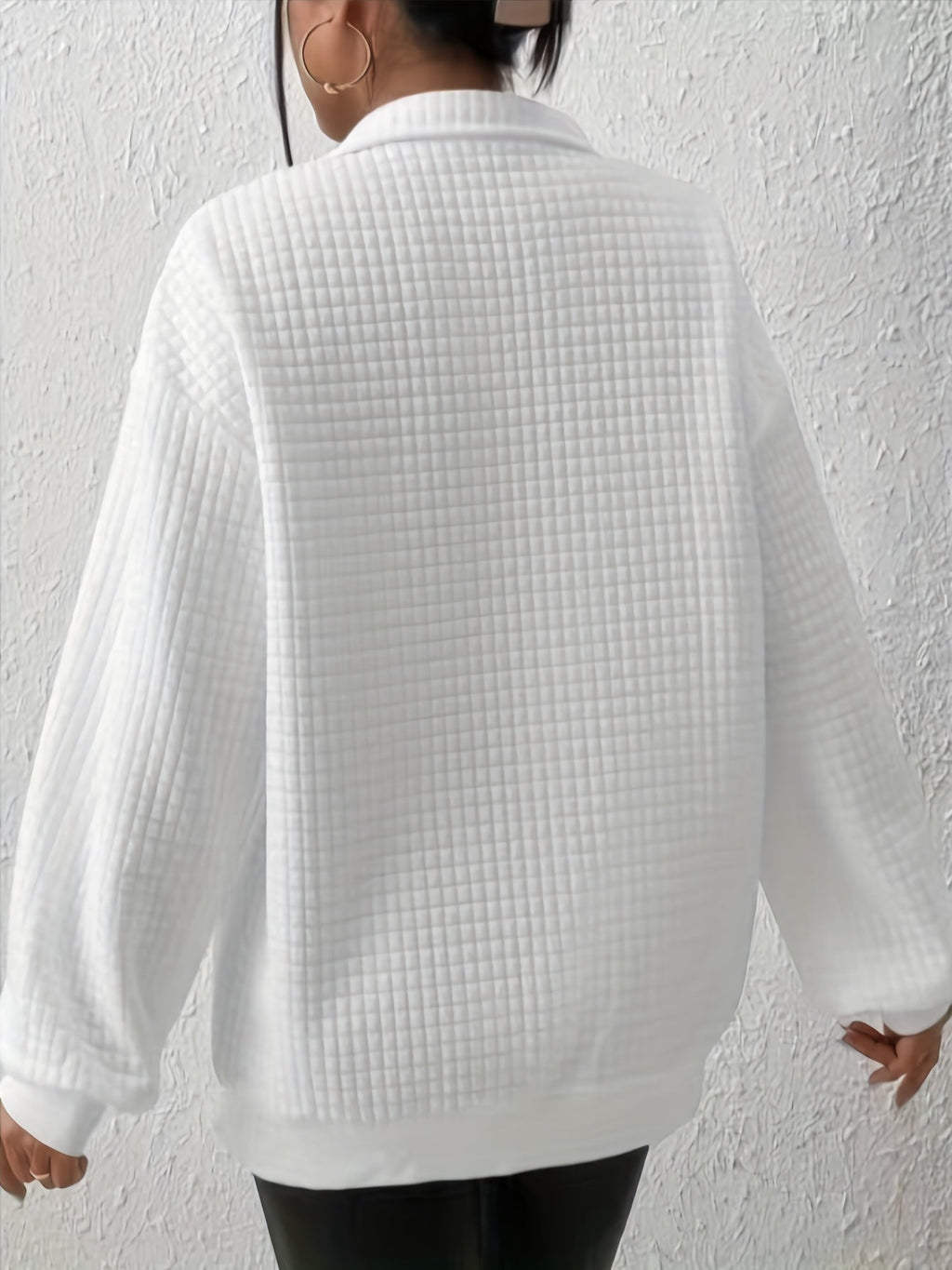 Woman wearing an oversized waffle knit quarter zip sweater with stand collar and ribbed cuffs - view 15
