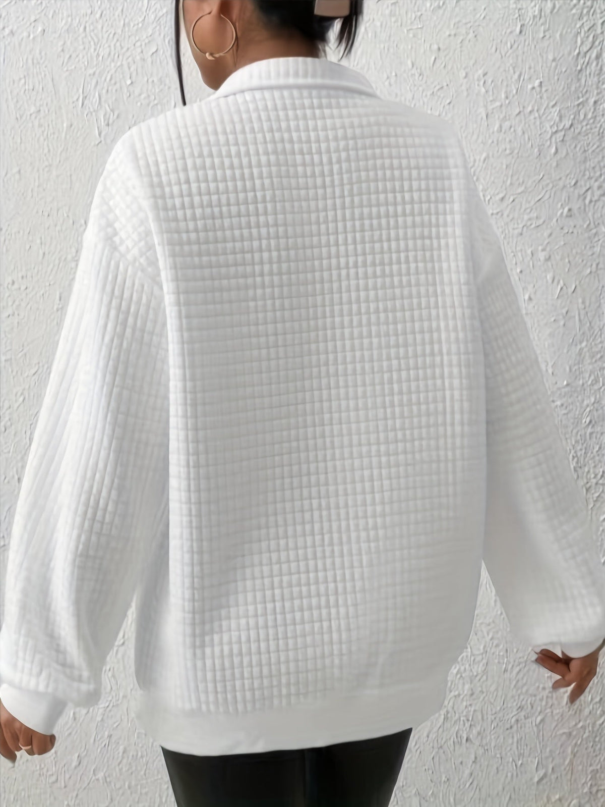 Woman wearing an oversized waffle knit quarter zip sweater with stand collar and ribbed cuffs - view 15