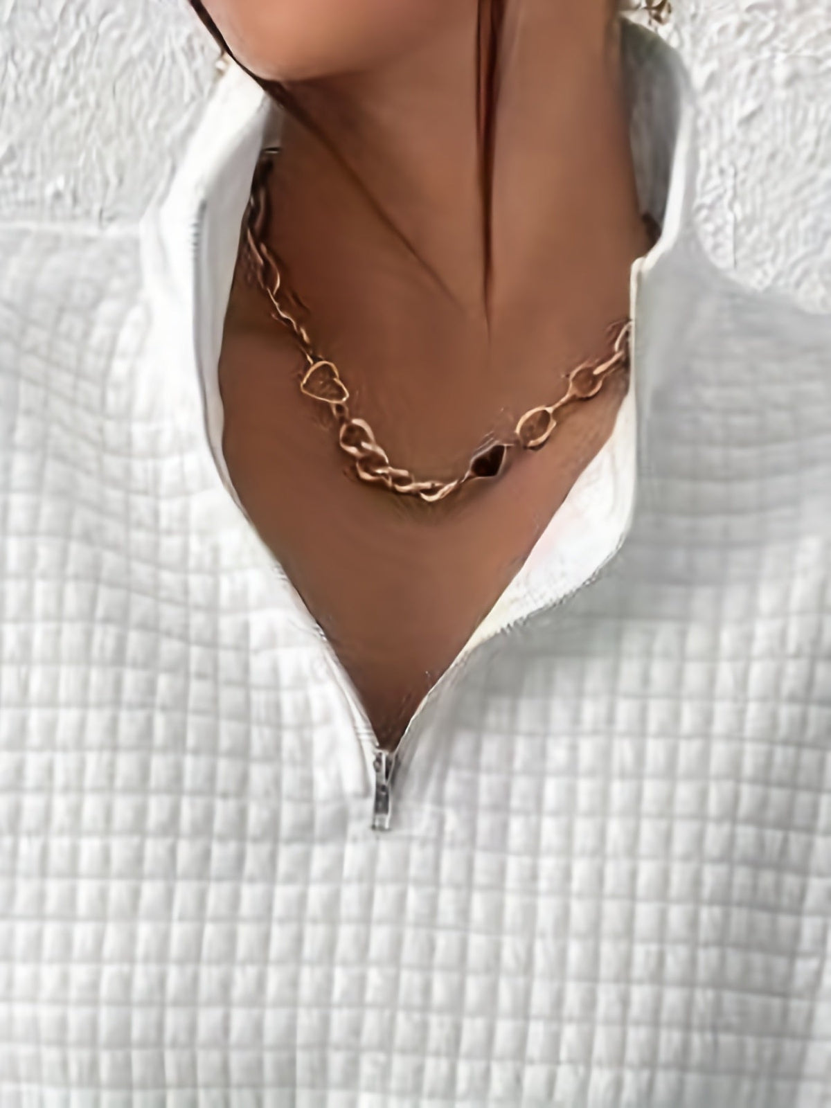 Woman wearing an oversized waffle knit quarter zip sweater with stand collar and ribbed cuffs - view 16