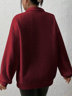 Woman wearing an oversized waffle knit quarter zip sweater with stand collar and ribbed cuffs - view 19