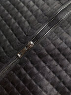 Woman wearing an oversized waffle knit quarter zip sweater with stand collar and ribbed cuffs - view 26