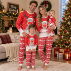 Family wearing matching red reindeer Christmas pajamas with Fair Isle-style pants