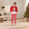 Family wearing matching red reindeer Christmas pajamas with Fair Isle-style pants - view 3