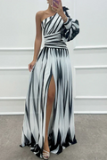 Woman wearing a striped one-shoulder maxi dress with balloon sleeve, ruched waist and high slit