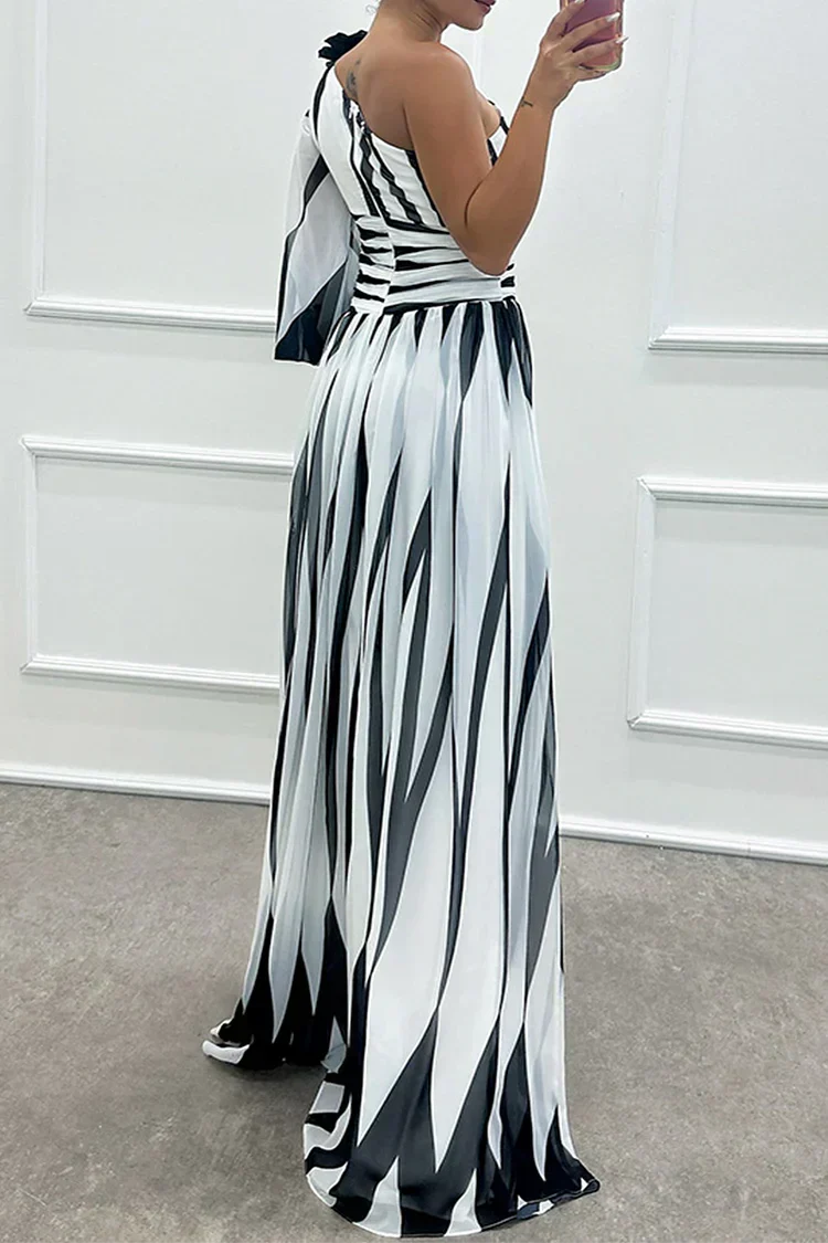 Woman wearing a striped one-shoulder maxi dress with balloon sleeve, ruched waist and high slit - view 6