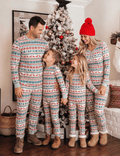 Matching family Christmas pajamas in red, green and cream Fair Isle reindeer print
