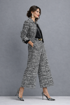 Woman wearing a black and white tweed-look cropped jacket and wide-leg pants matching set - view 2