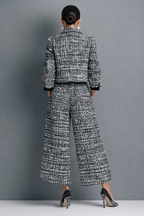 Woman wearing a black and white tweed-look cropped jacket and wide-leg pants matching set - view 3