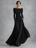 Black boat neck long sleeve maxi dress with draped waist and flowing skirt
