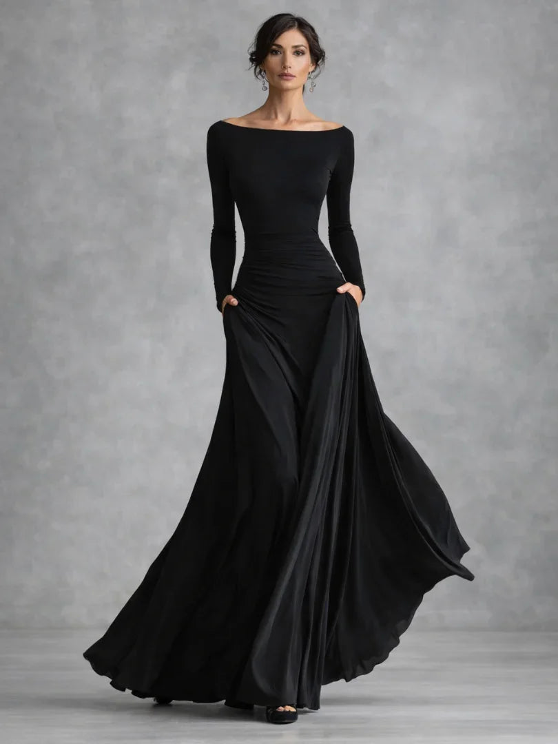 Black boat neck long sleeve maxi dress with draped waist and flowing skirt