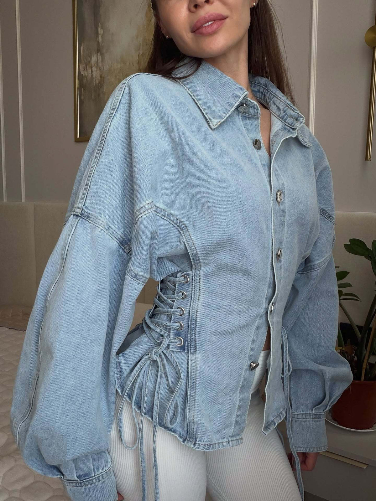 Light wash balloon sleeve denim jacket with collar and lace-up sides