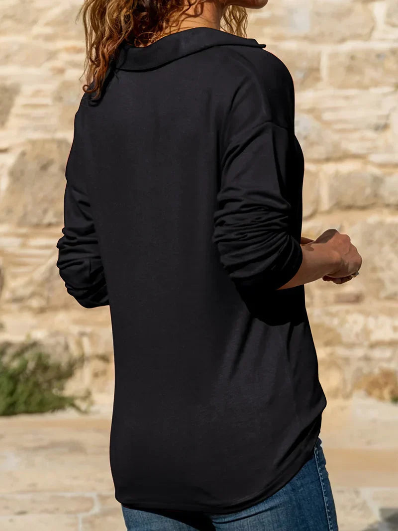Woman wearing a collared quarter zip sweater with ring-pull zip and long sleeves, tucked into jeans - view 7