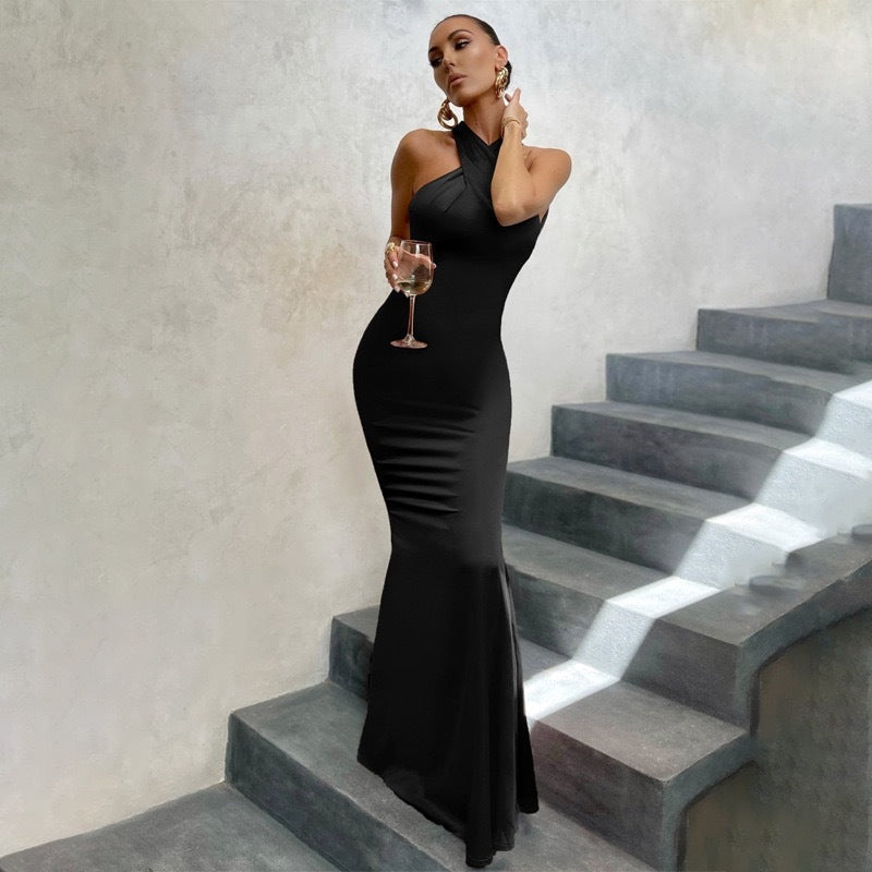 Halter neck mermaid maxi evening dress with twisted neckline, open back and fishtail hem