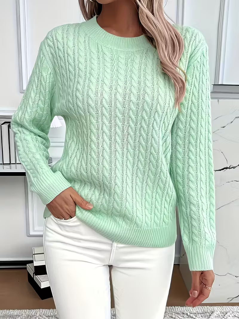 Women's cable knit crew neck sweater with ribbed cuffs and hem