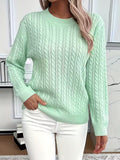 Women's cable knit crew neck sweater with ribbed cuffs and hem