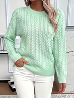 Women's cable knit crew neck sweater with ribbed cuffs and hem