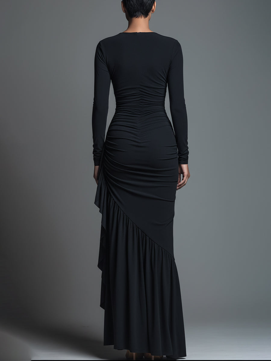 Model in a black formal evening maxi dress with long sleeves and draped skirt - view 6