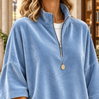 Woman wearing an oversized velvet quarter zip pullover with stand collar and three-quarter sleeves - view 2